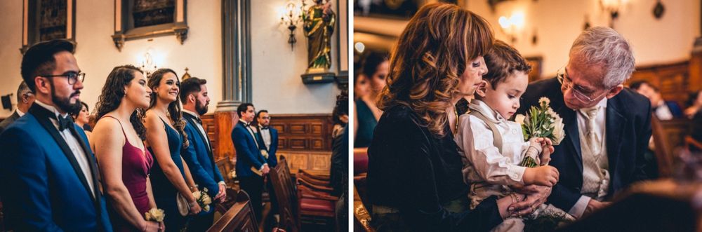 Wedding guests mingle during reception in beautifully lit venue space.