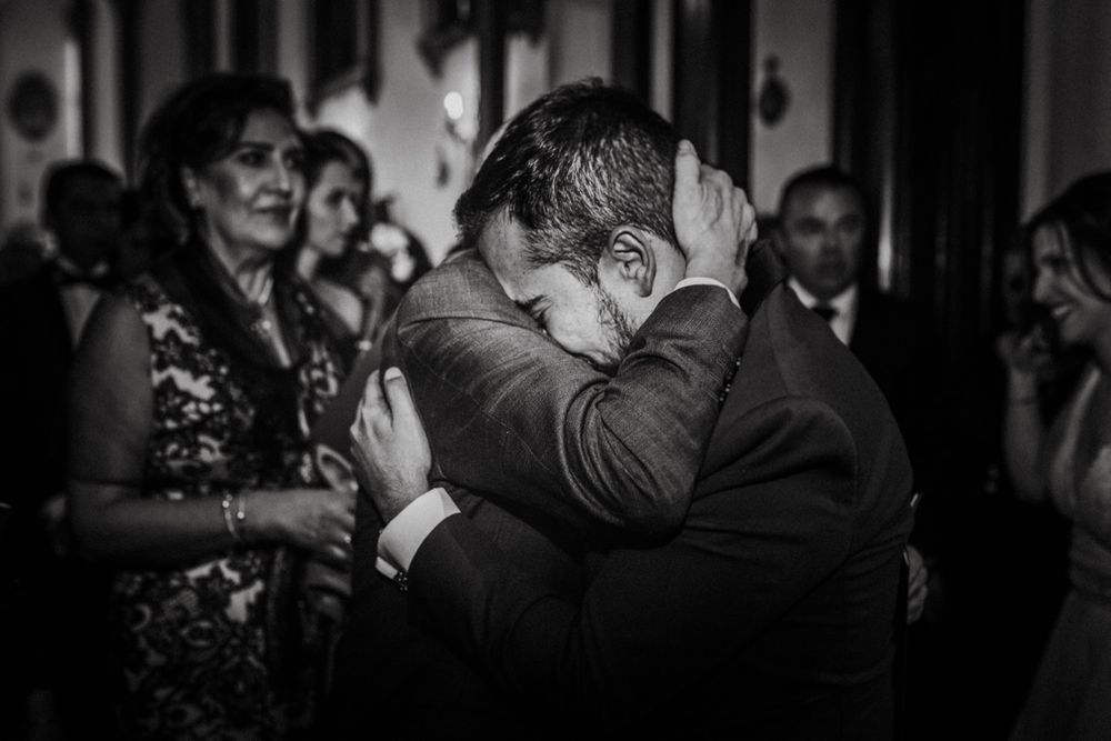 Emotional wedding moments captured in dramatic black and white photography.
