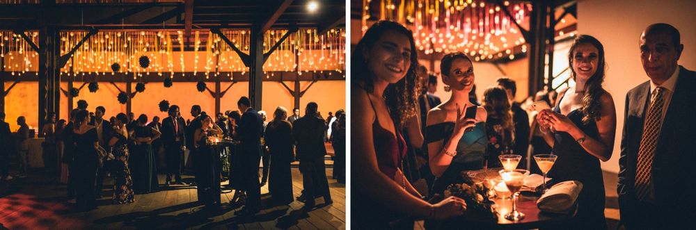 A warmly lit indoor event space with hanging lights creating an intimate atmosphere.