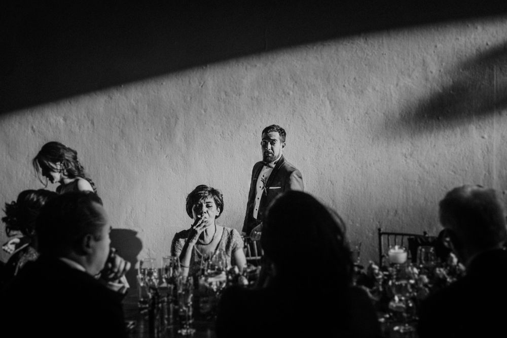 A high contrast black and white image with dramatic shadows and silhouettes.