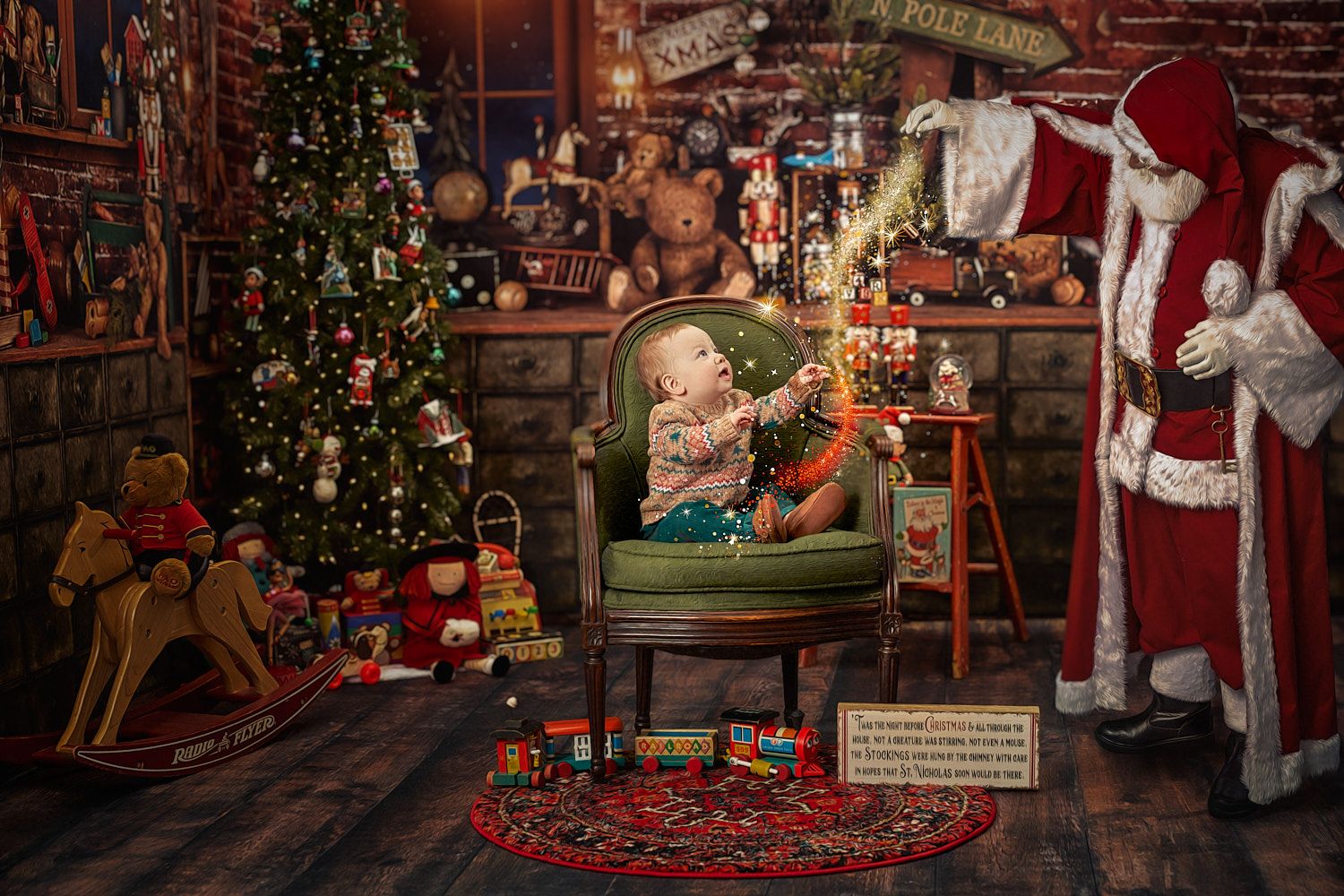 Ten-month-old boy reaching up to Santa with glitter stream