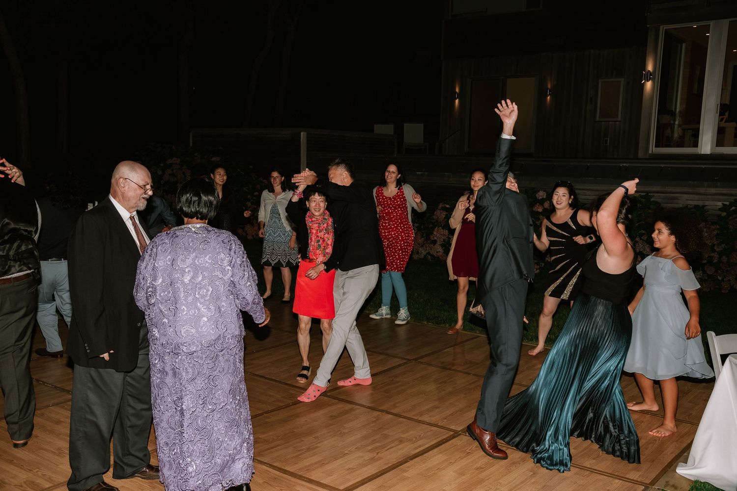 Dance Floor with guests during Melodie & Kevin Wedding Ceremony at Cape Cod, MA