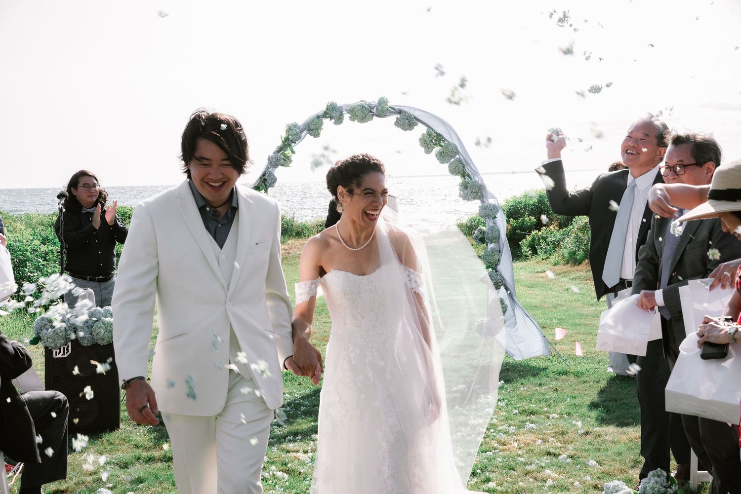 Melodie & Kevin walking down the aisle at their Wedding Ceremony at Cape Cod, MA