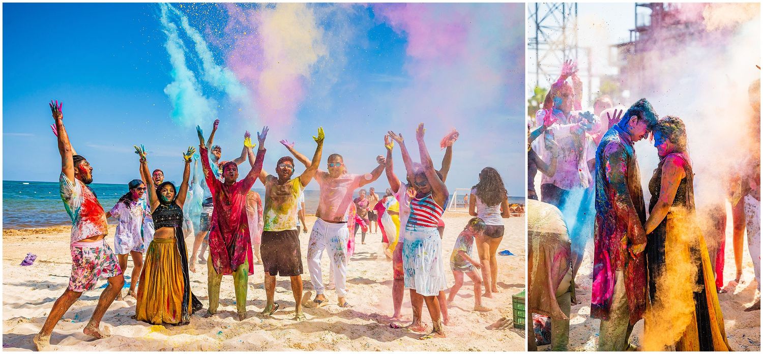 Celebratory moment with colorful powder toss on beach creating vibrant clouds in the air.
