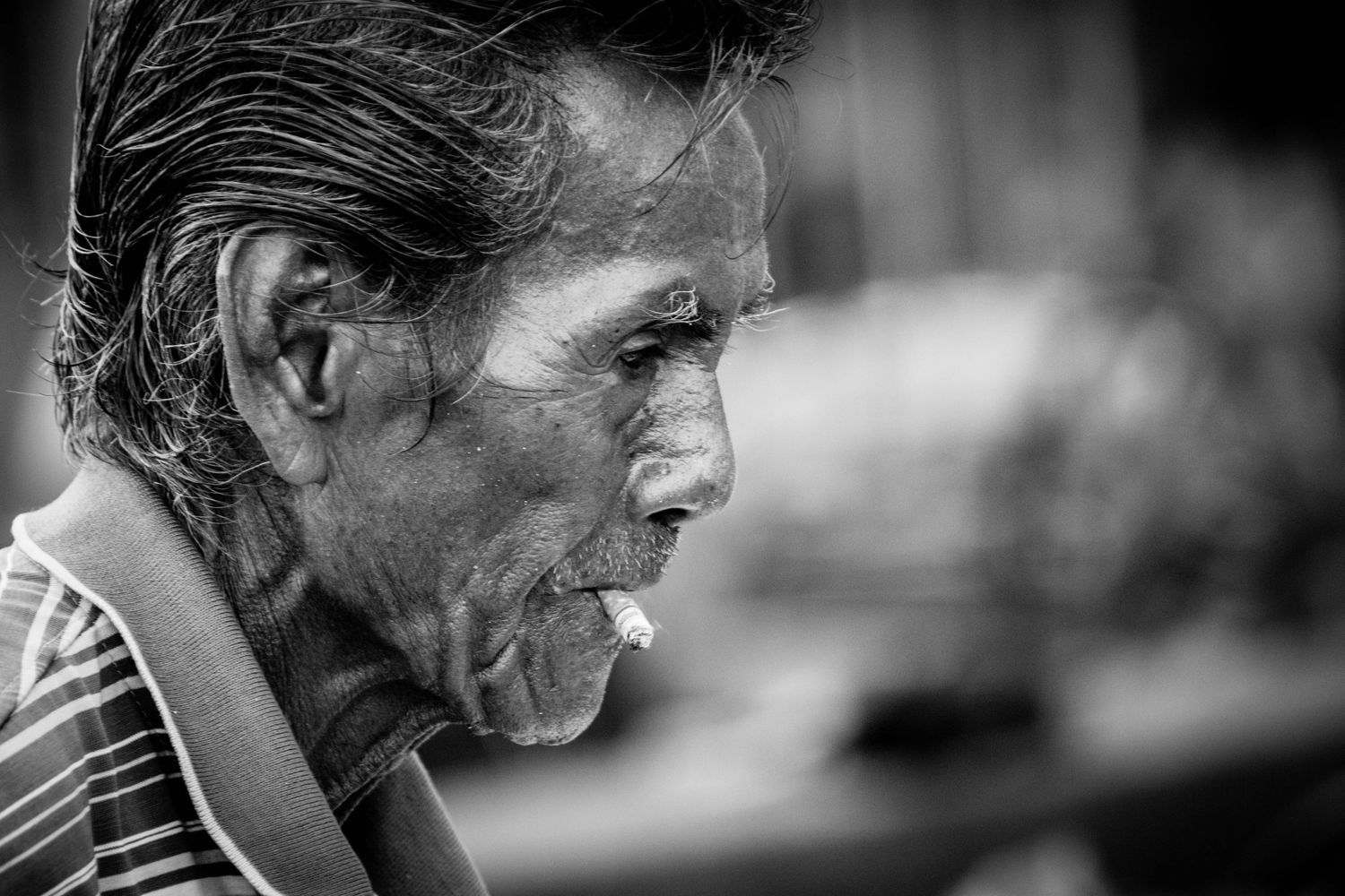 Environmental portrait of flower outside Pak Khlong Talat (Flower Market) in Thailand