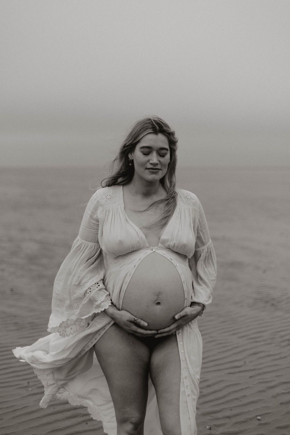 expectant mother on the beach