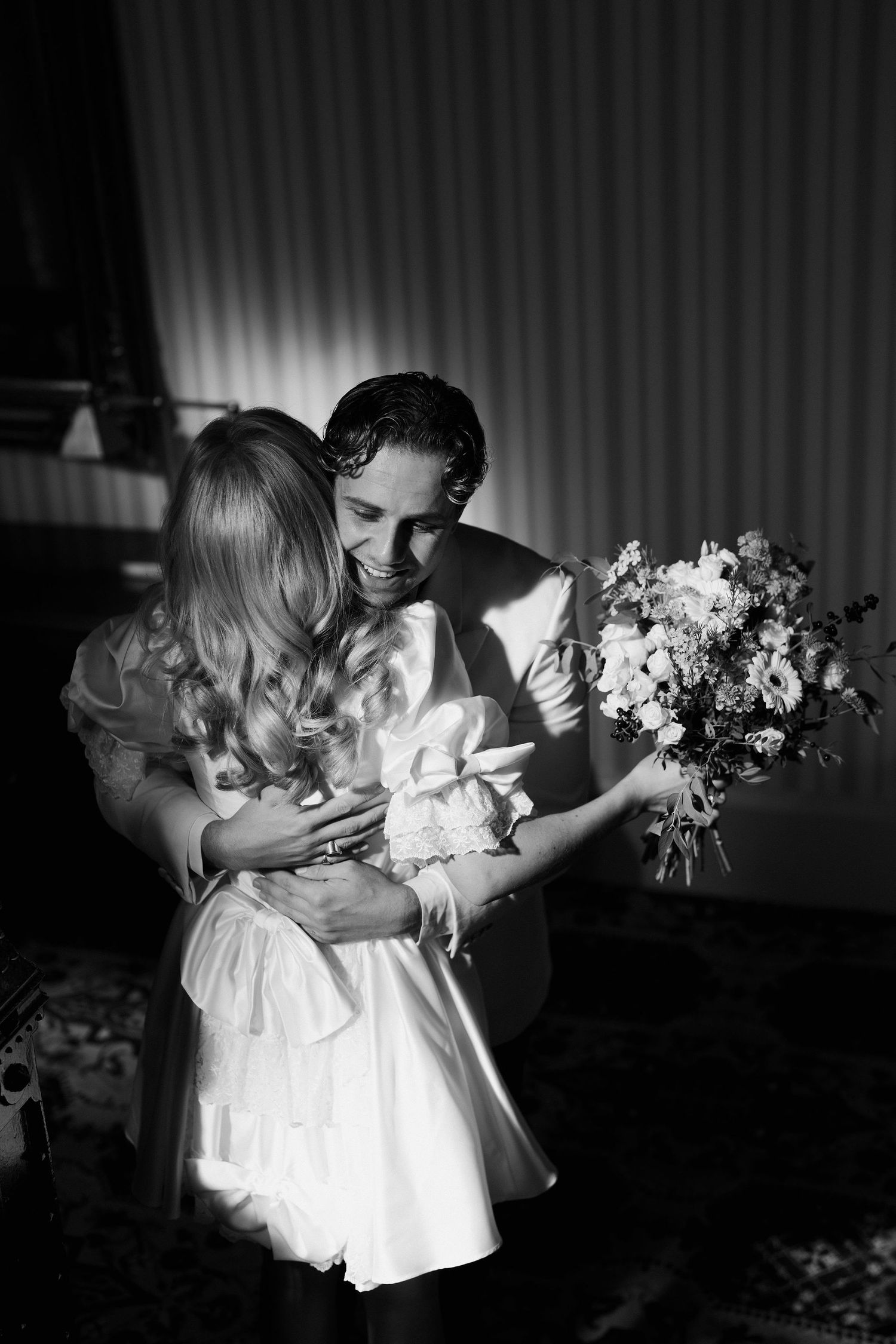groom hugging bride at first look at the Randolph hotel in oxford