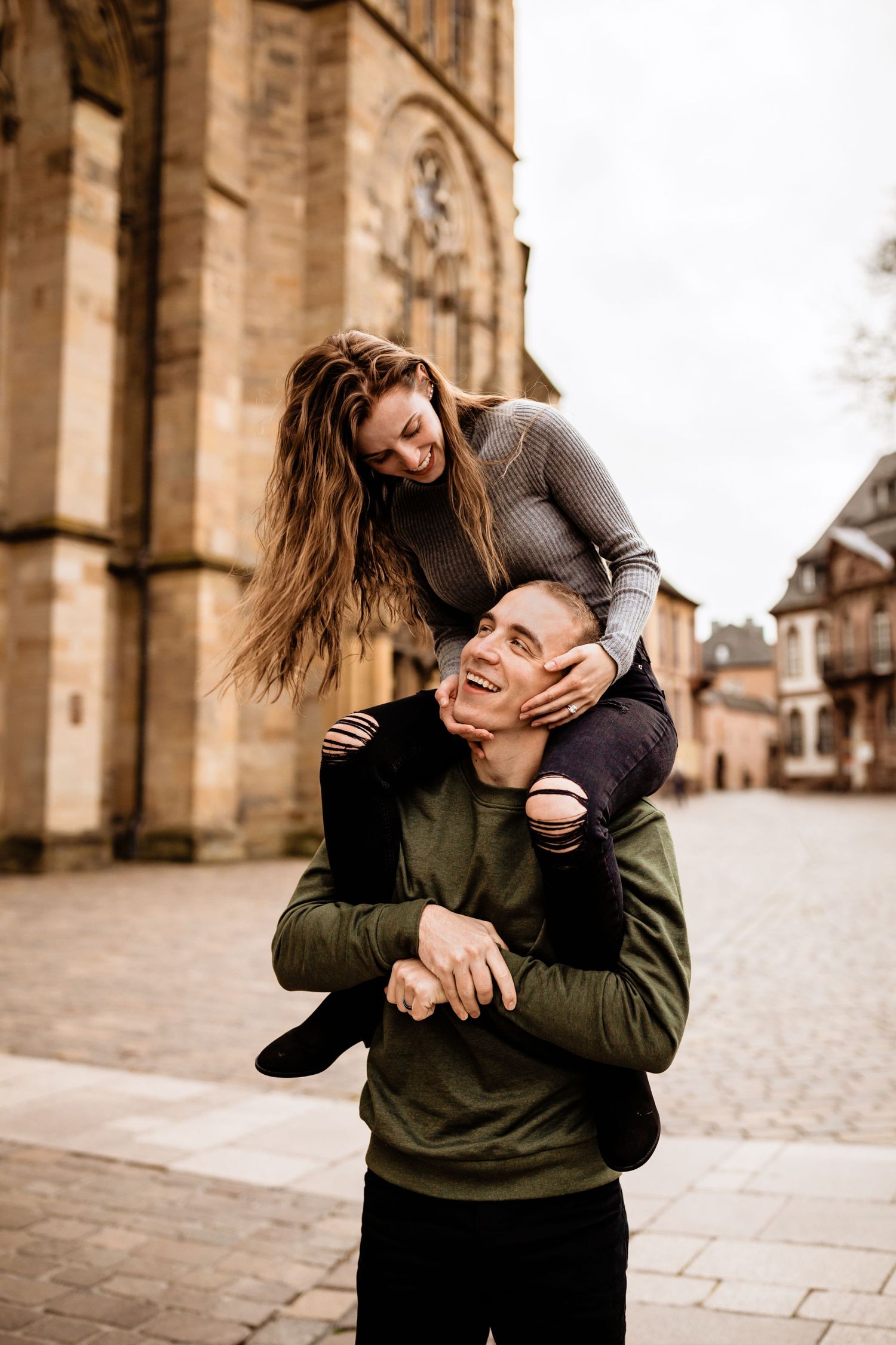 Couple in city riding shoulders