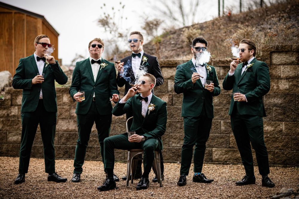 Groom and groomsmen enjoying cigars and whiskey in Bella Vista, Arkansas