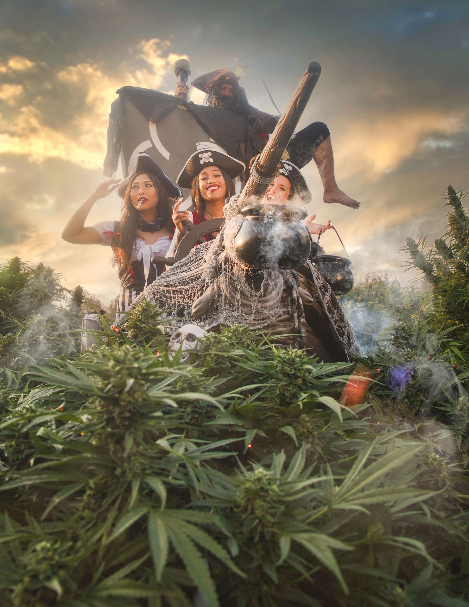 Creative fantasy photo of three women in Halloween costumes surrounded by cannabis plants.