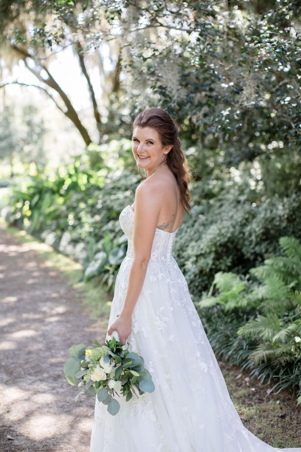 Garden bridal portrait with natural light filtering through Spanish moss.