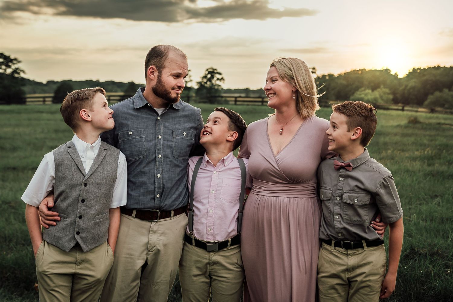 Family session on Long Branch Historic Farm in Millwood Virginia, family looking and laughing all dressed up