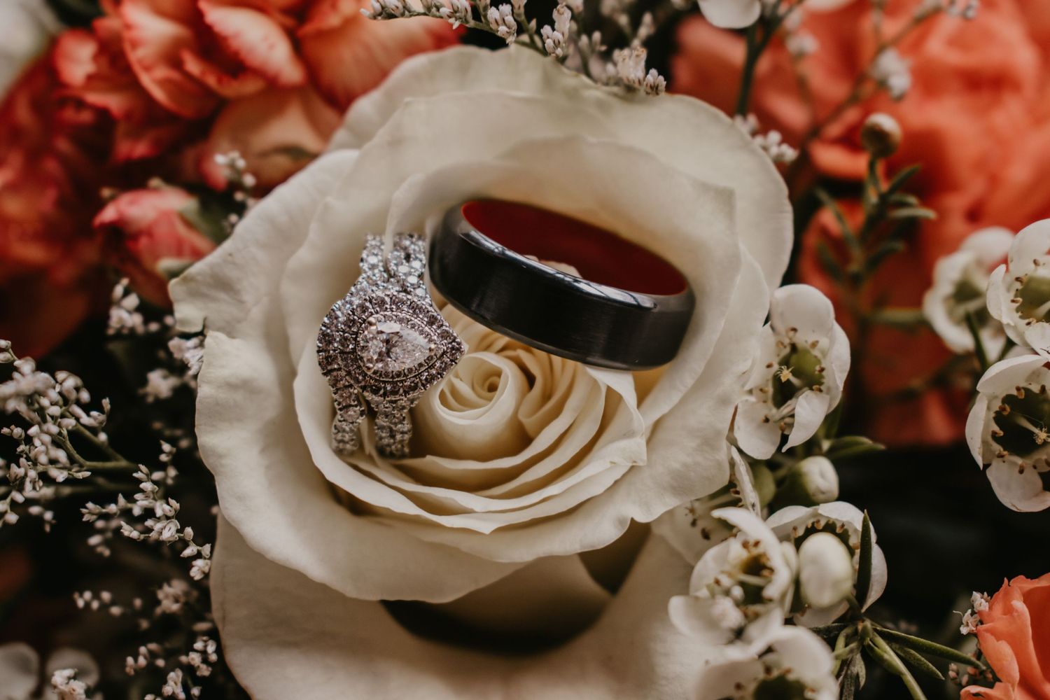 wedding rings in rose of bouquet