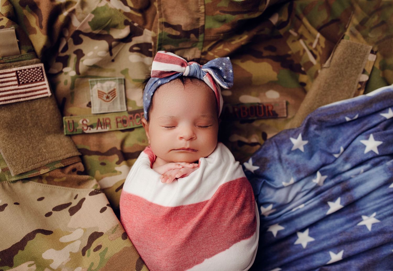 military newborn photographer baby photographer army uniform American flag military flag baby military family photo