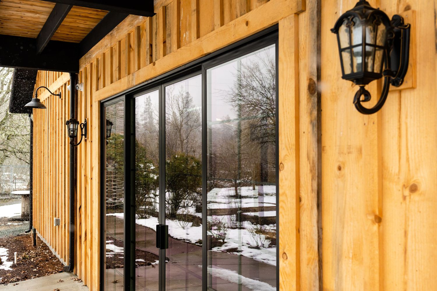 windows in a barn with a reflection of snow