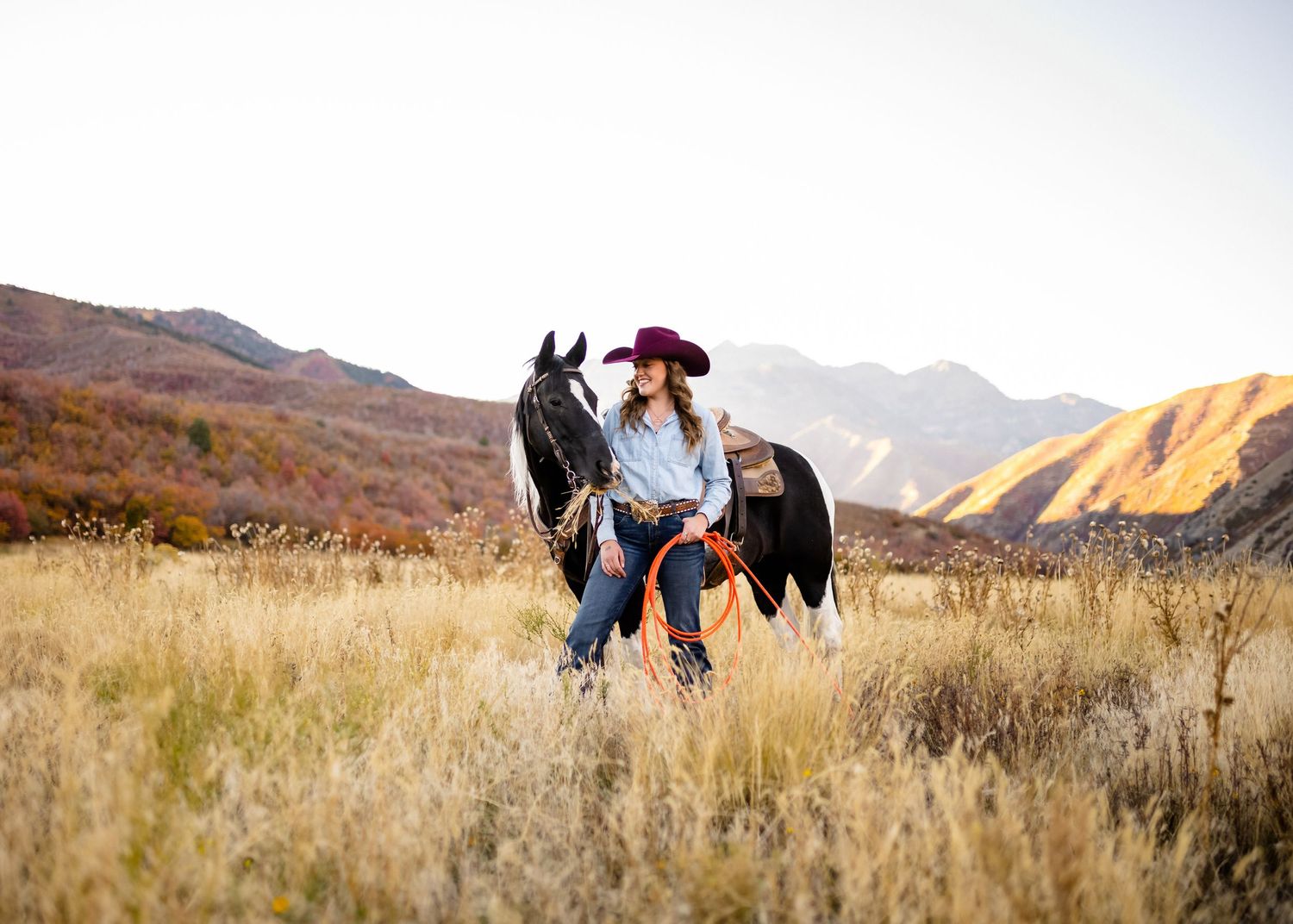 Romantic couple photography session in golden mountain landscape at sunset.