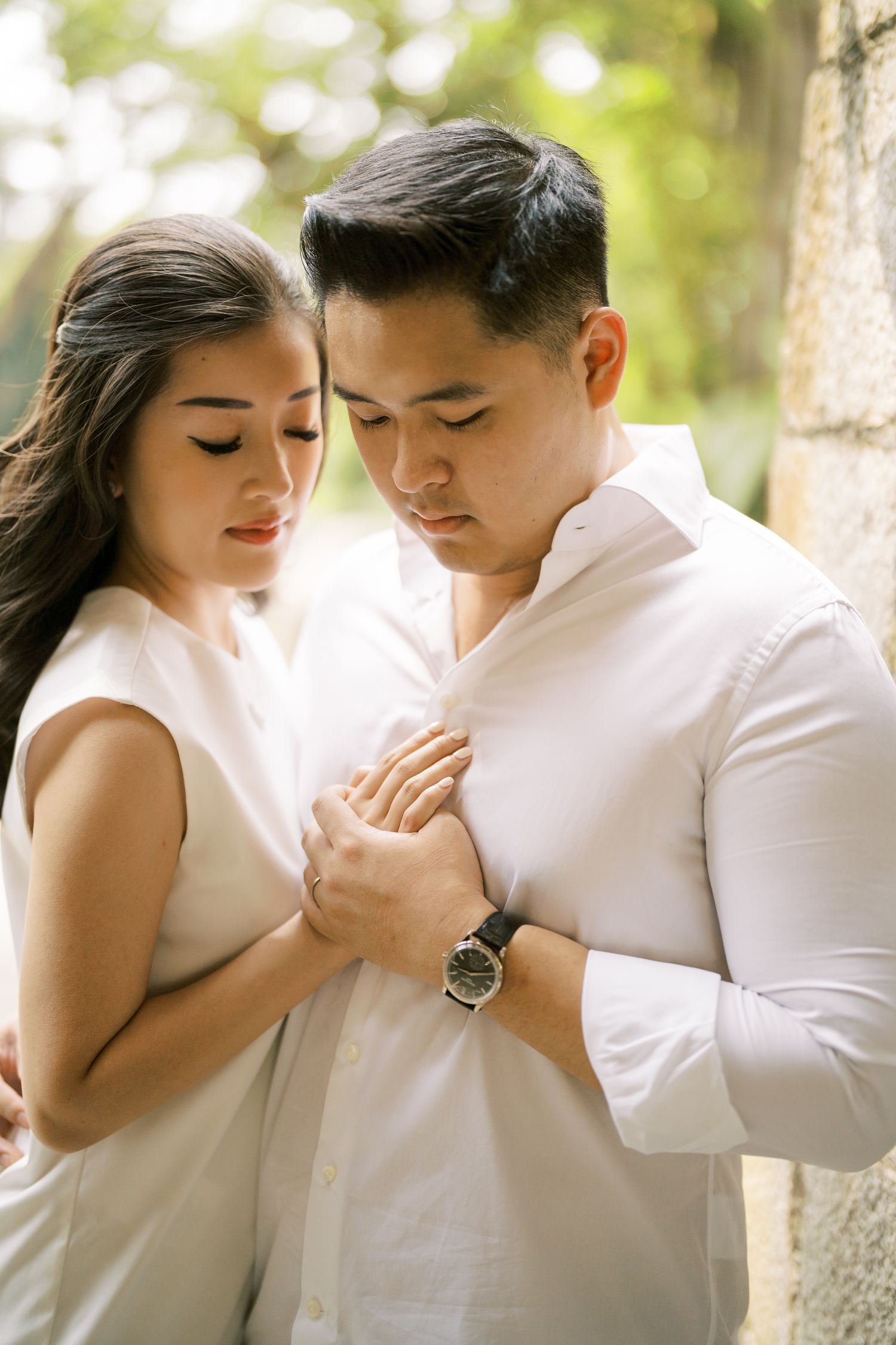 Romantic portrait series in white attire against natural outdoor setting.