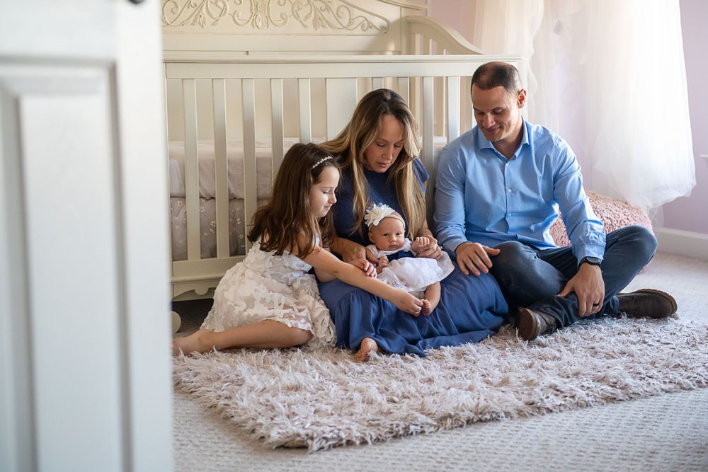 Series of candid family portraits on floor showing natural interactions and connections.