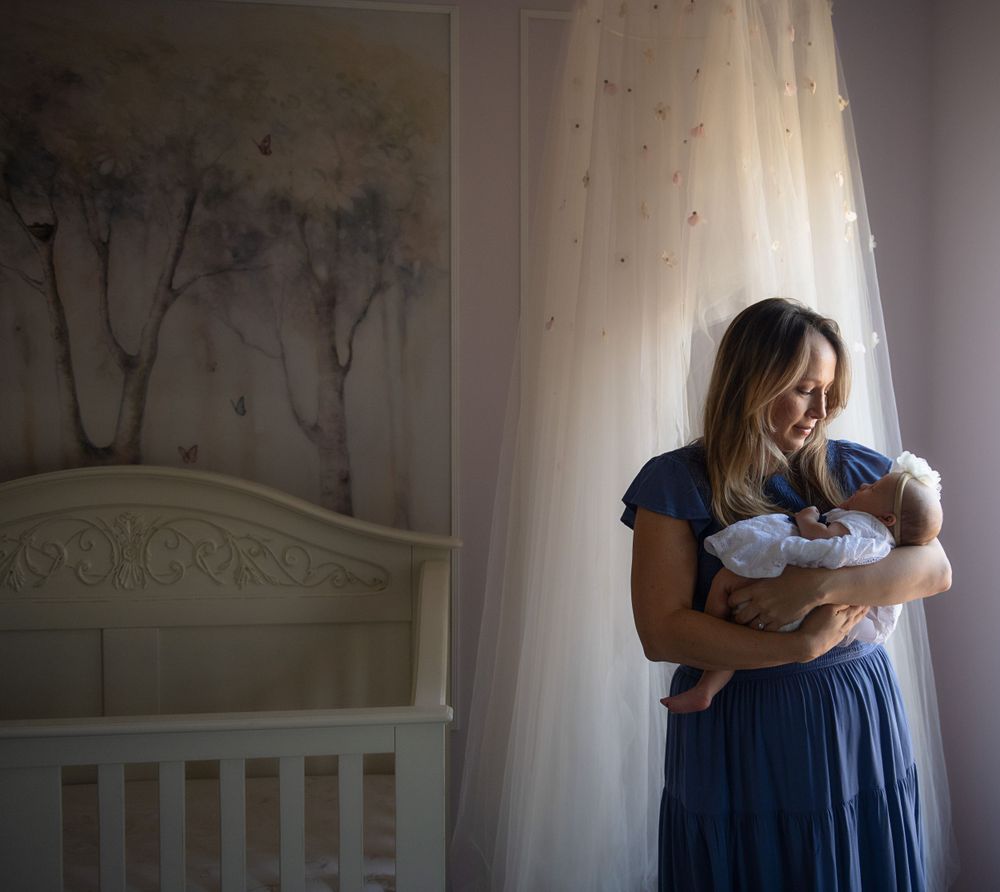 A series of intimate family moments captured in warm indoor lighting.