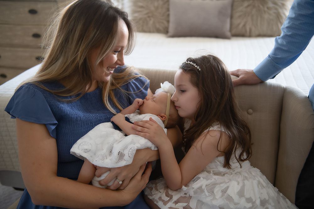 Tender family interactions captured on a cozy couch.