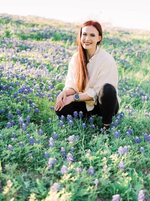 Girl smiling in bluebonnets - branding session