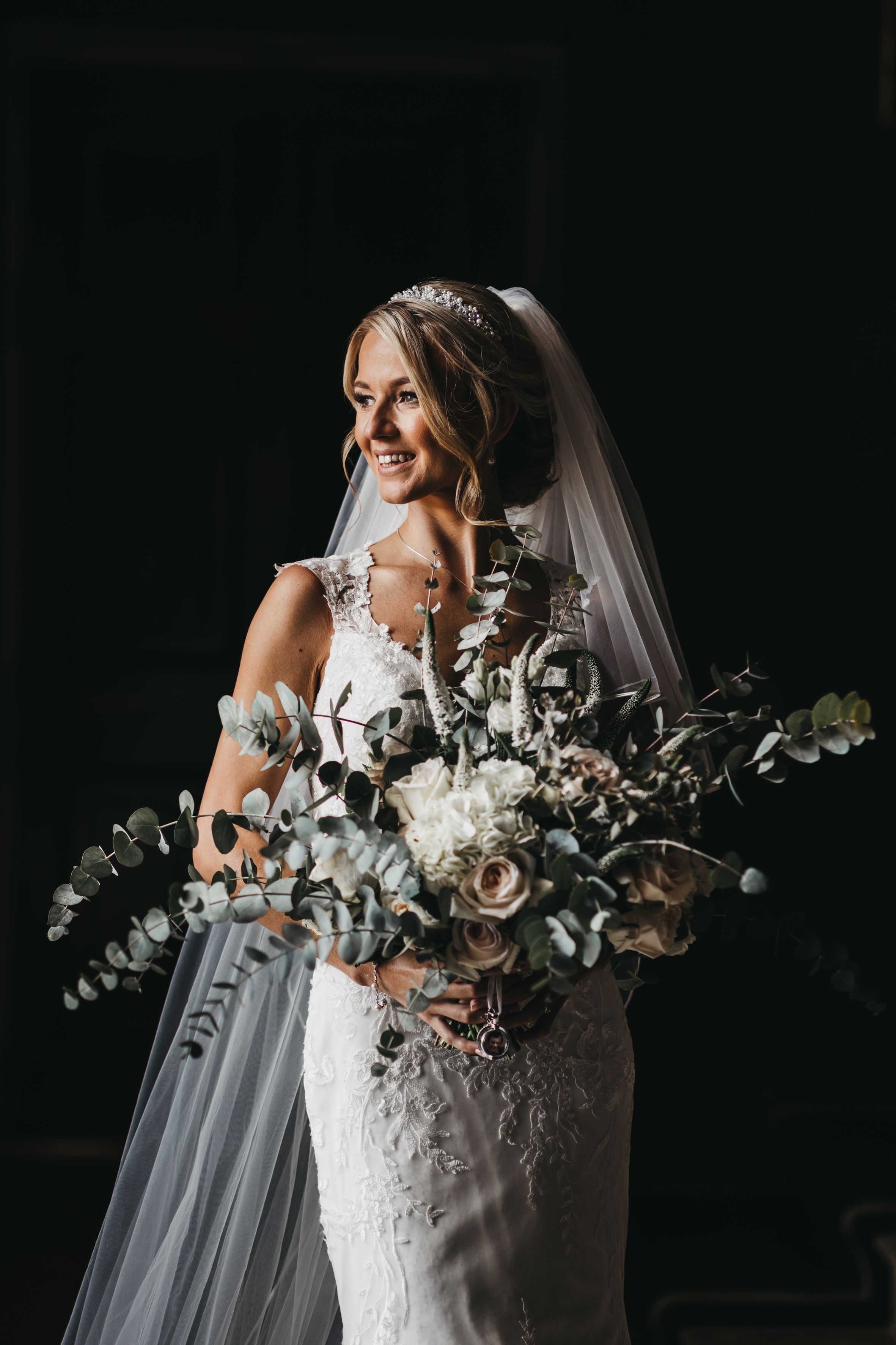 Bride holding very large bouquet at Stubton Hall