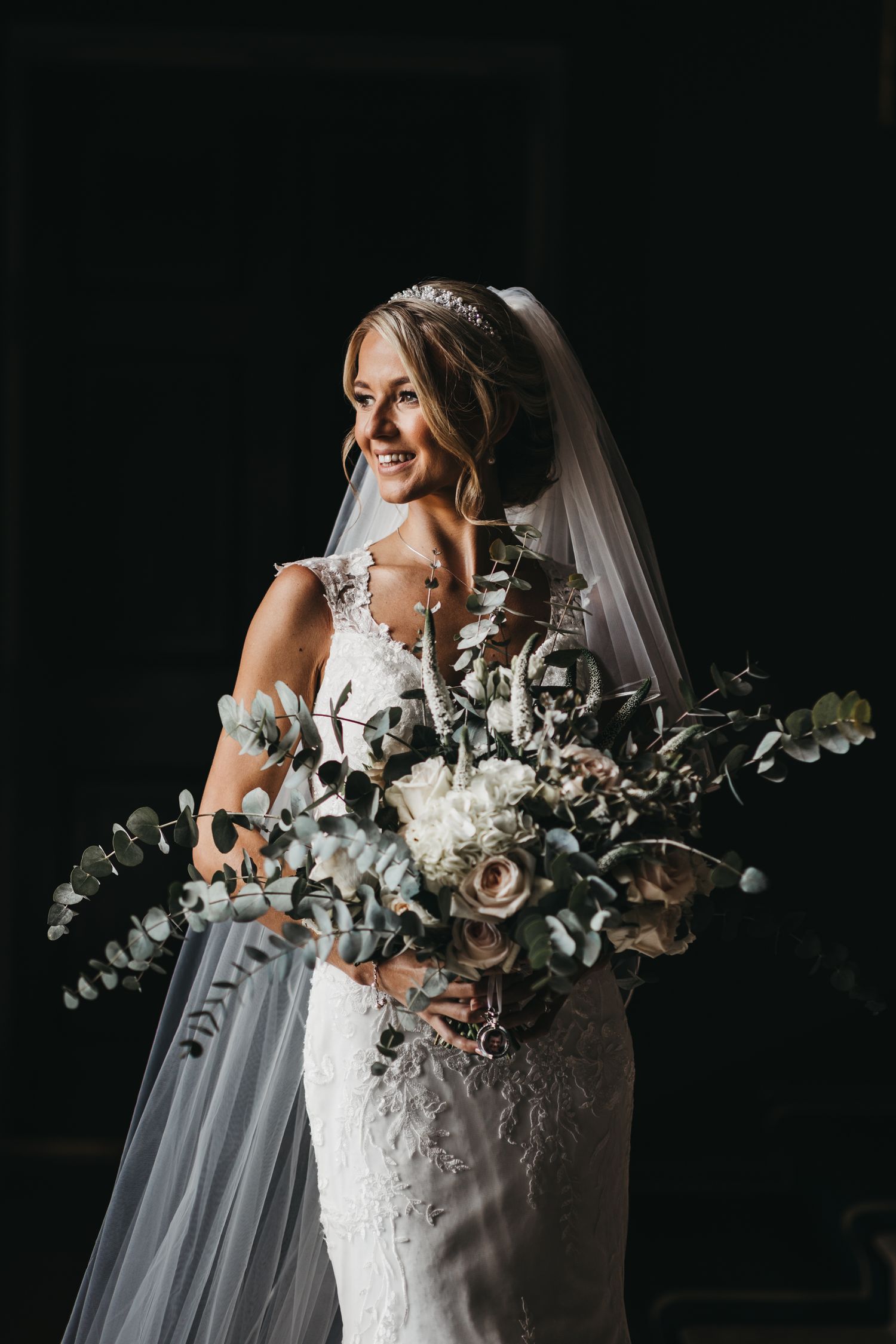 Bride holding very large bouquet at Stubton Hall