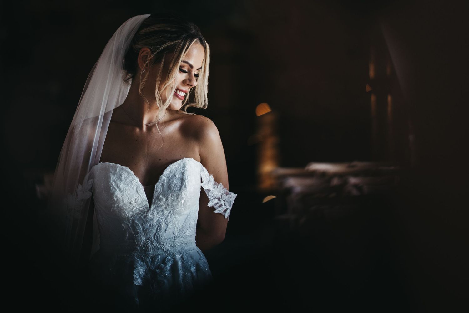 Bridal portrait of a bride looking down and smiling