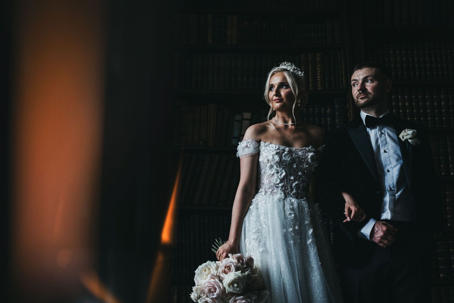 Cool wedding couple stood in window light at Norwood Park