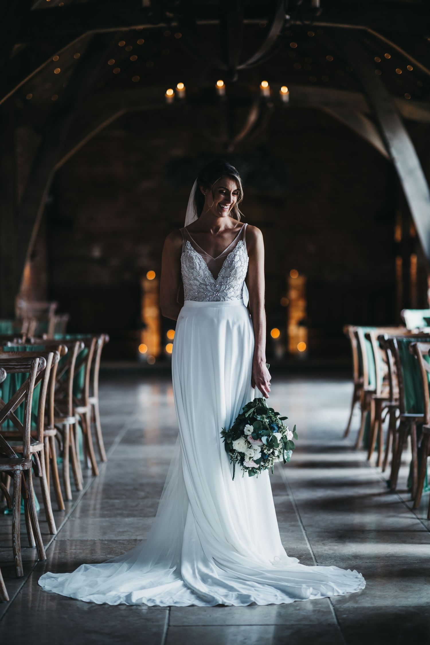 A boho bride stood in the aisle at Grangefields wedding barn