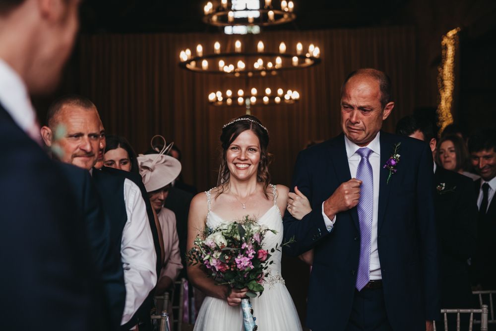 bride and father of the bride in tears