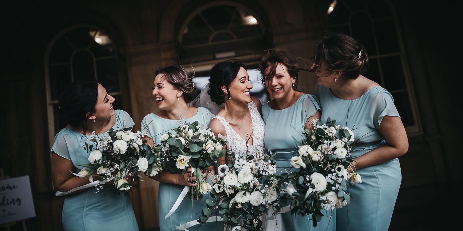 Bride and bridesmaids holding wedding bouquets