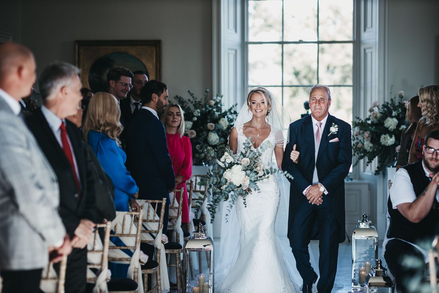 The bride walking into the ceremony at Stubton hall with her father