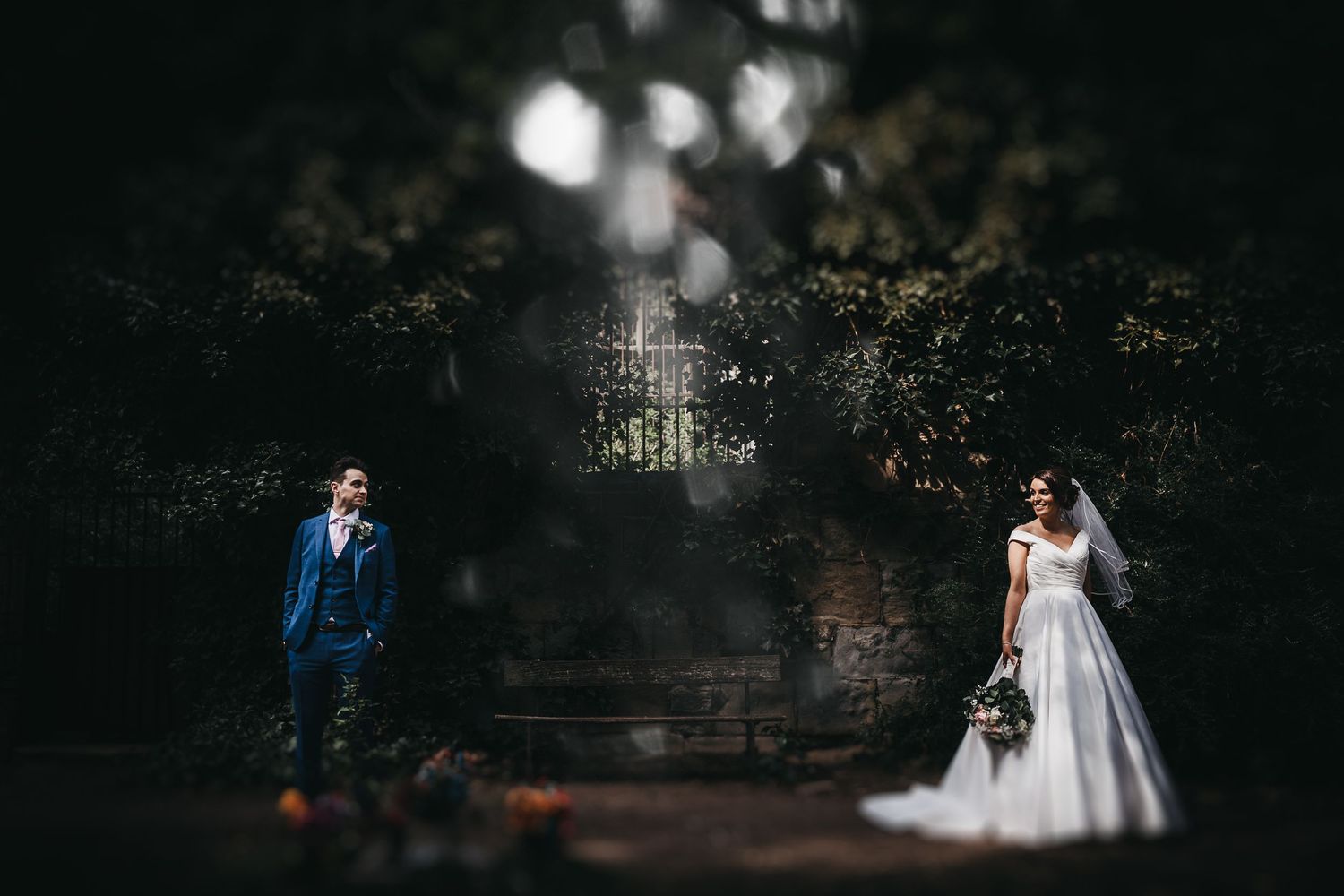 bride and groom in woodland at Cowlich Hall