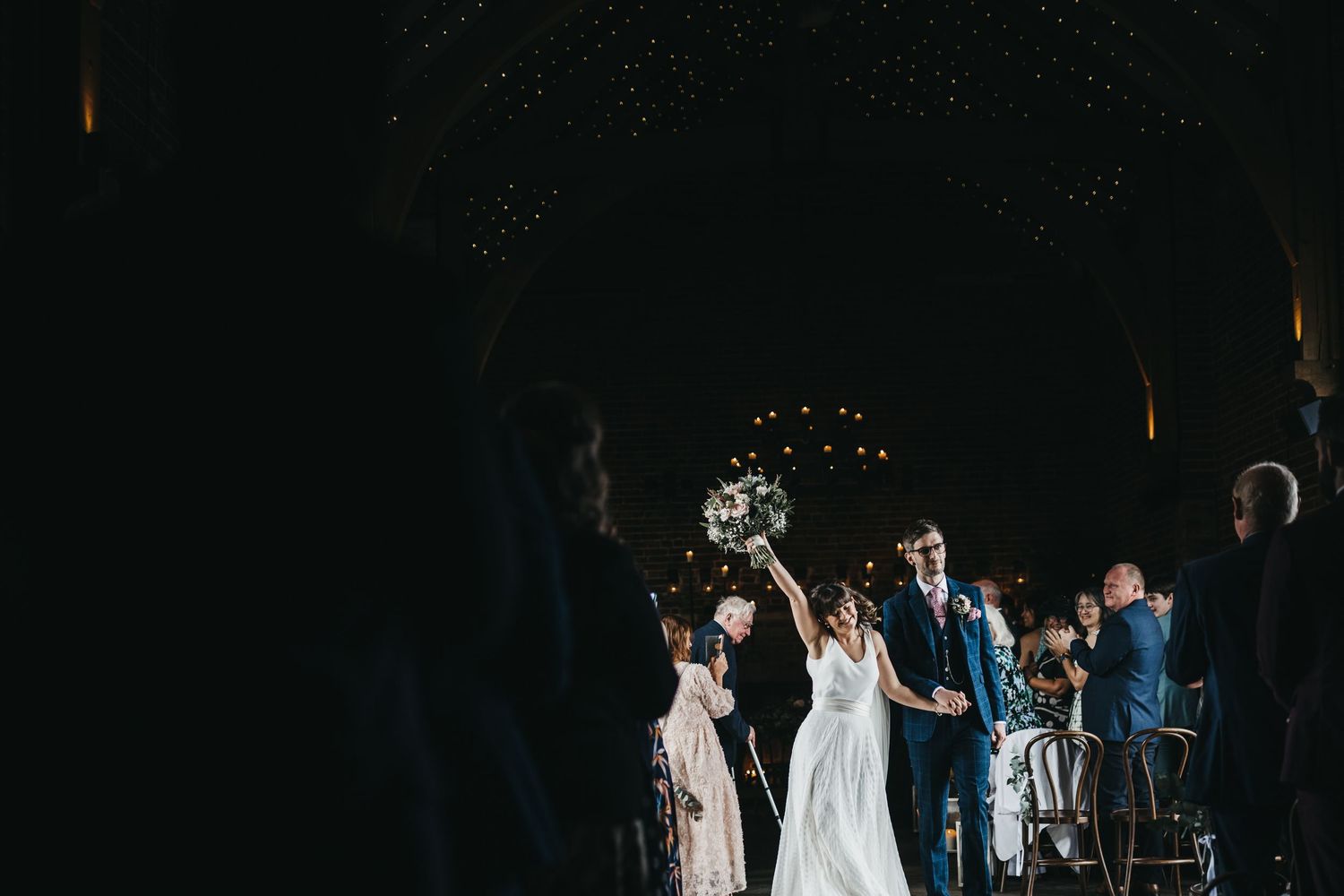 Bride throwing hand into the air after getting married  at Hazel Gap