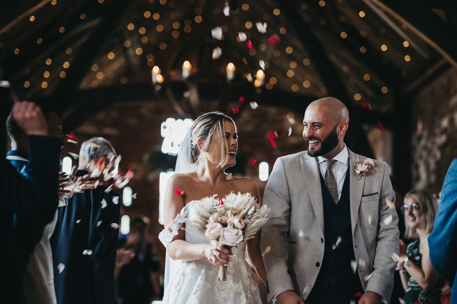 Newly married couple leaving the ceremony at Grangefields