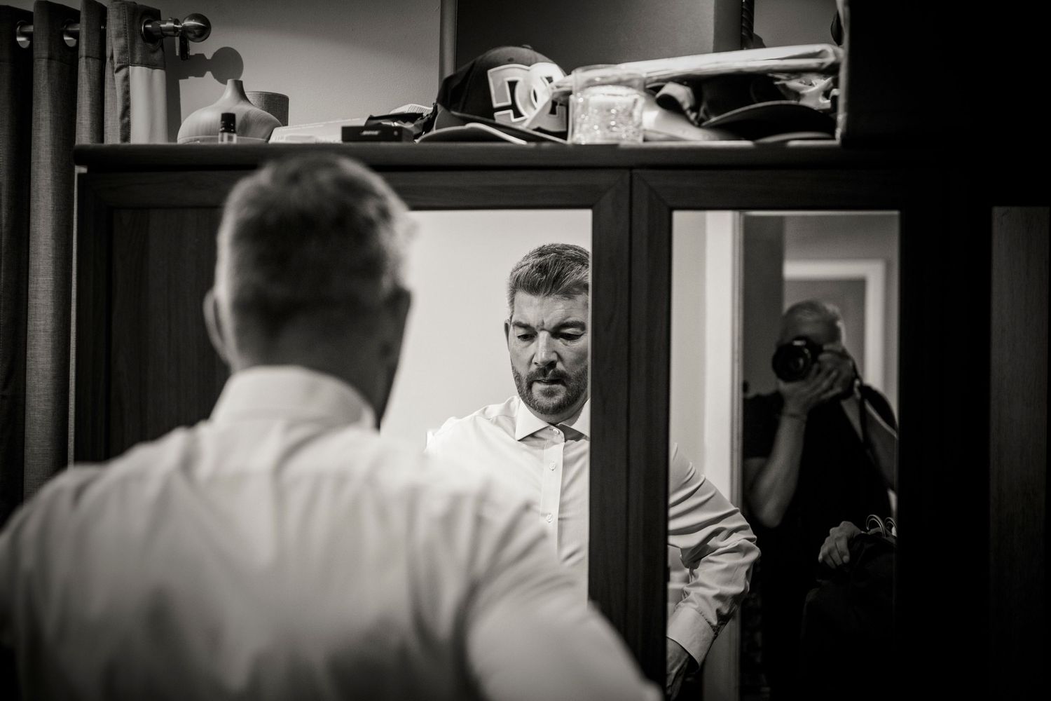 Black and white candid shots capture pre-wedding moments in an indoor setting.