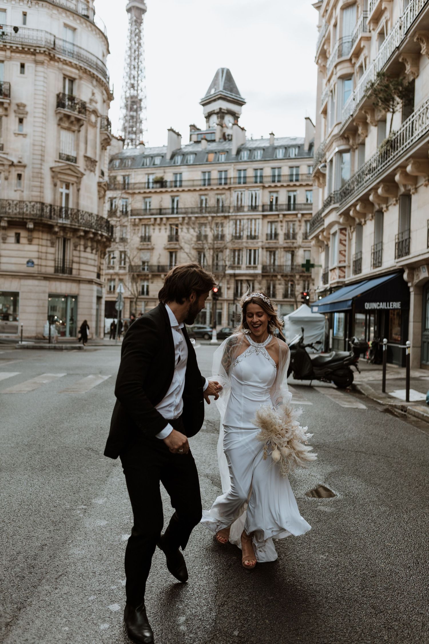 Paris elopement running through the streets of the city laughing