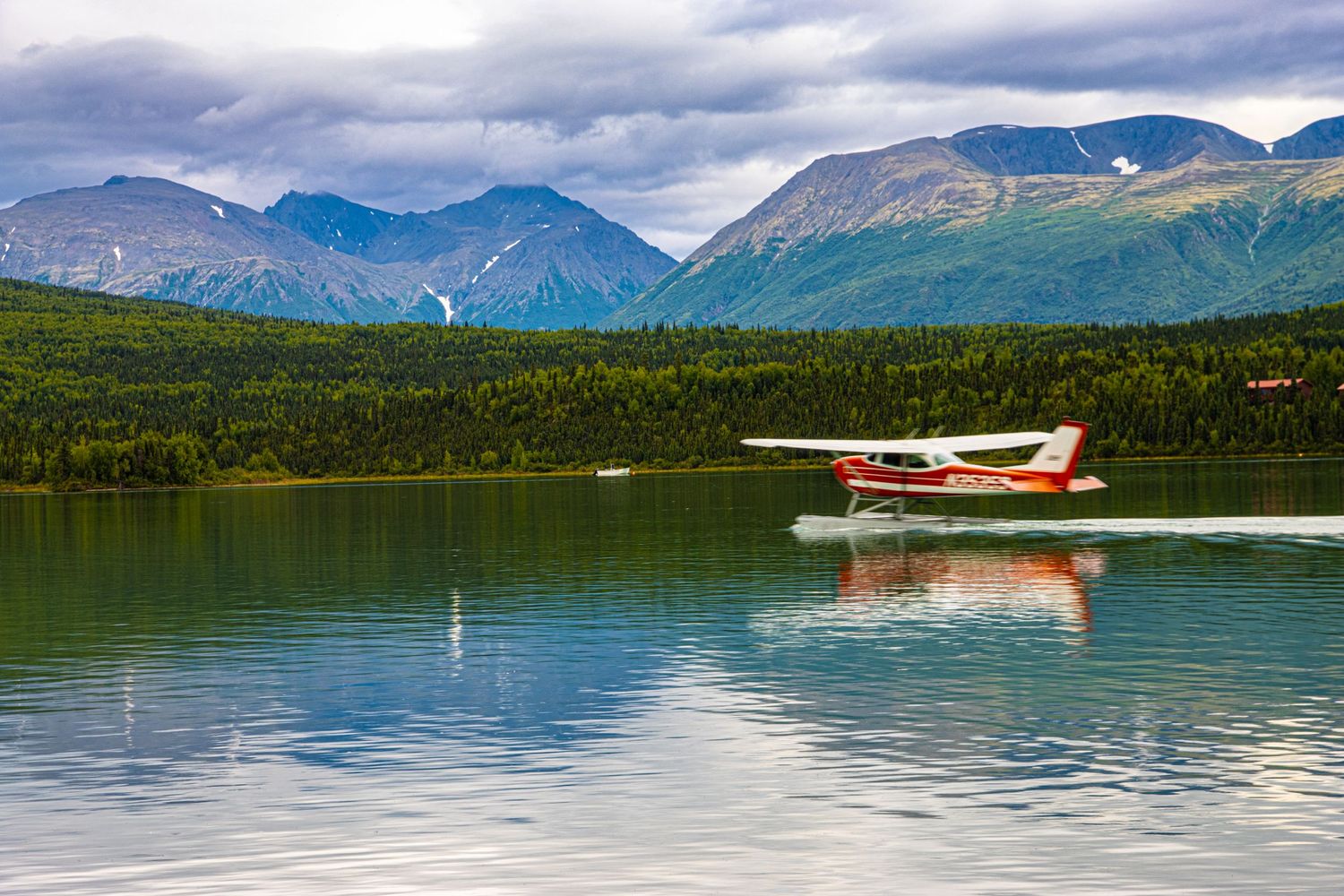 Cory J. Cravatta photo of a seaplane taking off from the water at Port Allsworth, Lake Clark National Park Alaska