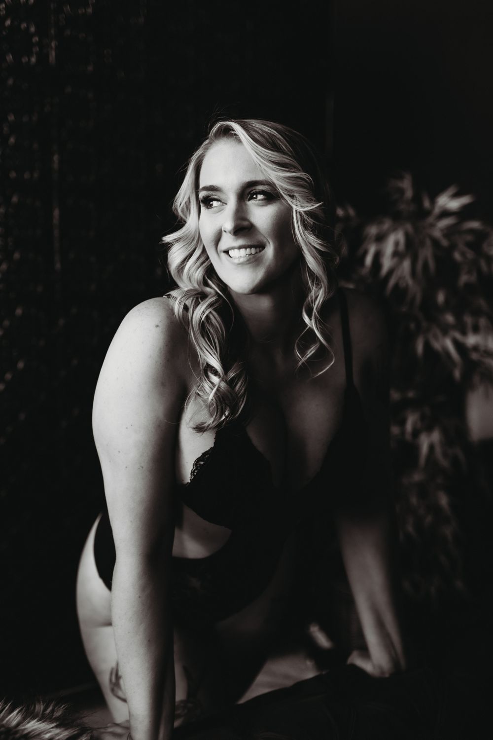 Black and white intimate portrait featuring soft lighting and natural expressions.