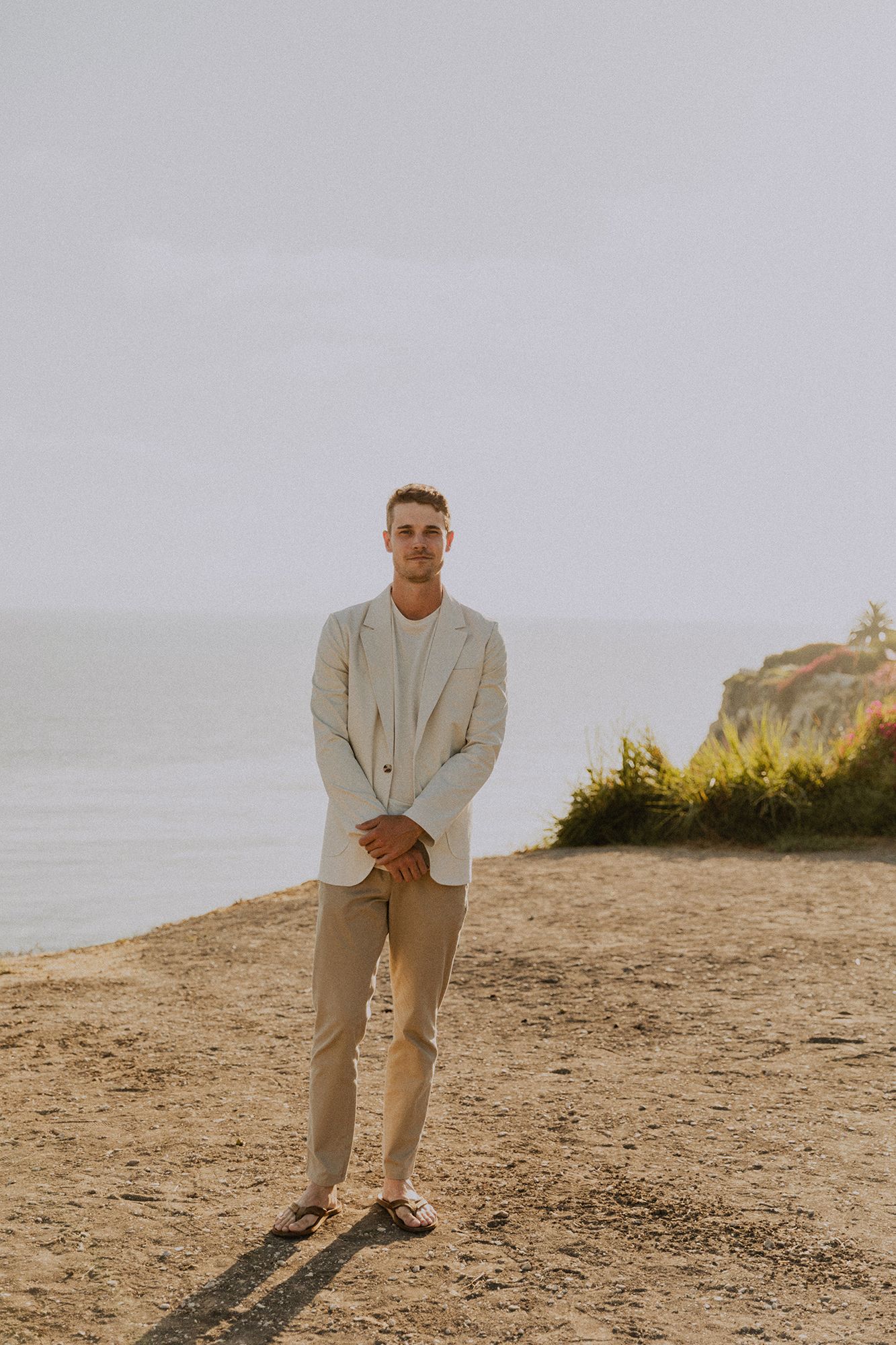 Groom portrait in tan and white suit