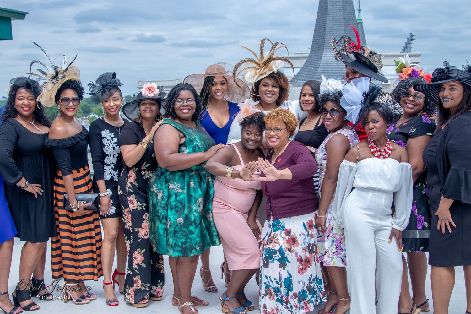 Large group celebration photo on a cruise ship deck with festive atmosphere.
