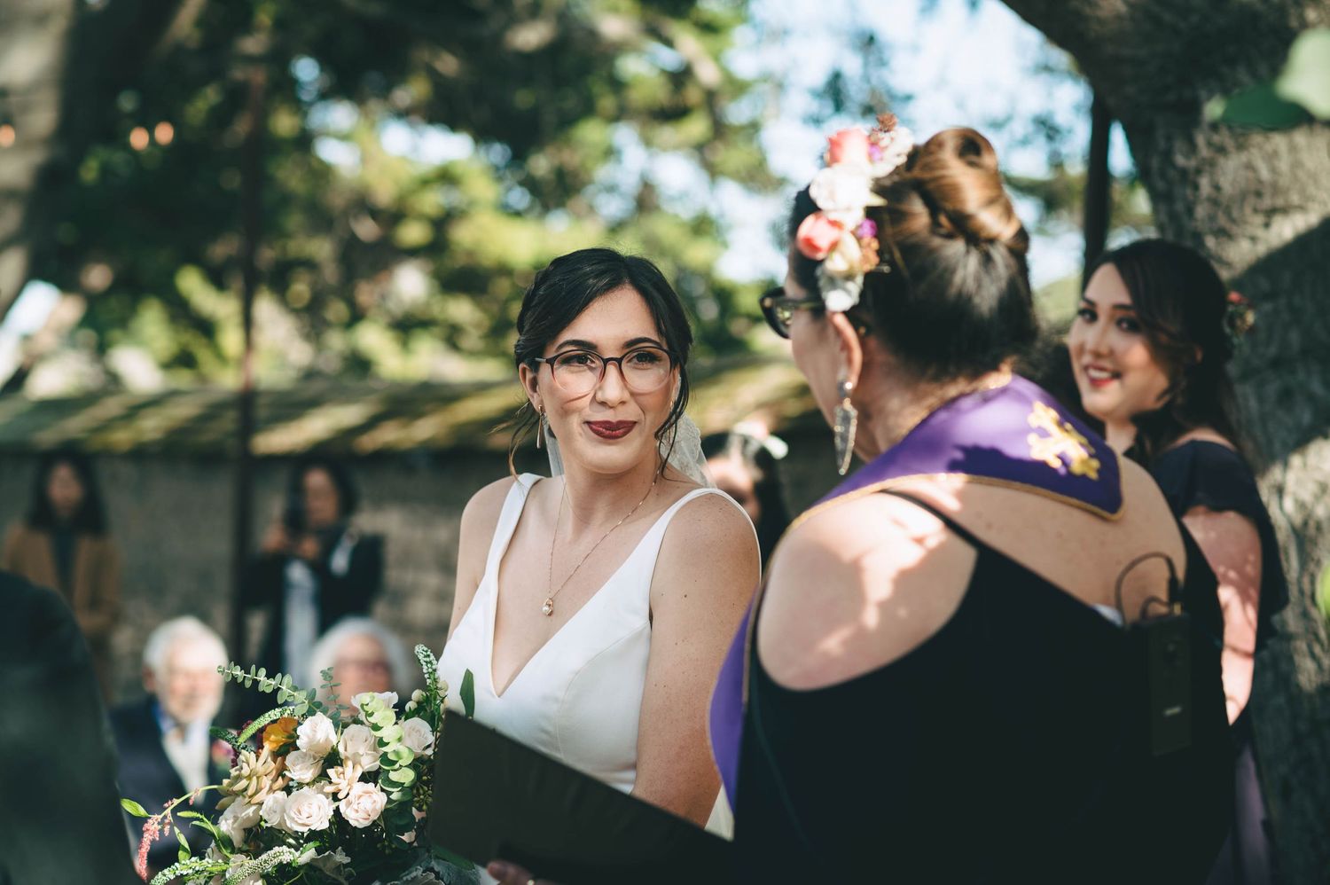 bride listening intently to officiant.