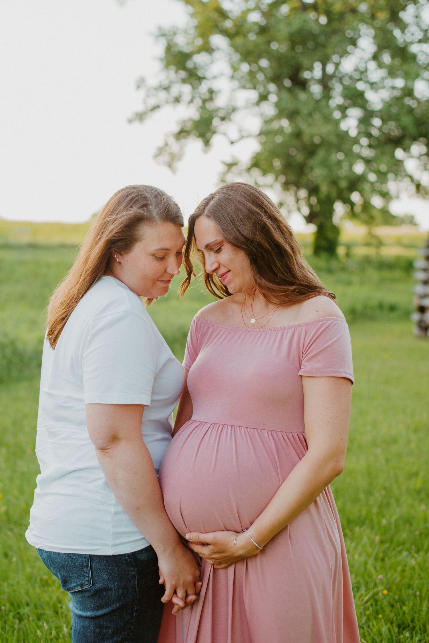 Two moms maternity session in Valley Forge Park during Golden Hour