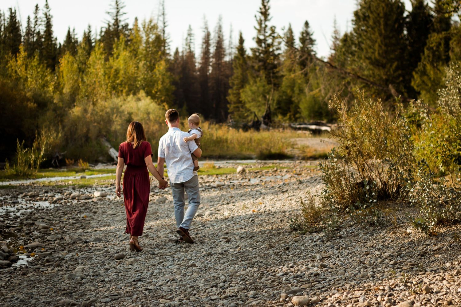 Beautiful fall family photos in September at Fish Creek Park in Calgary during golden hour.