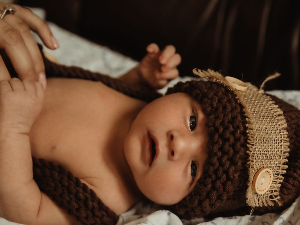 Newborn looks at camera