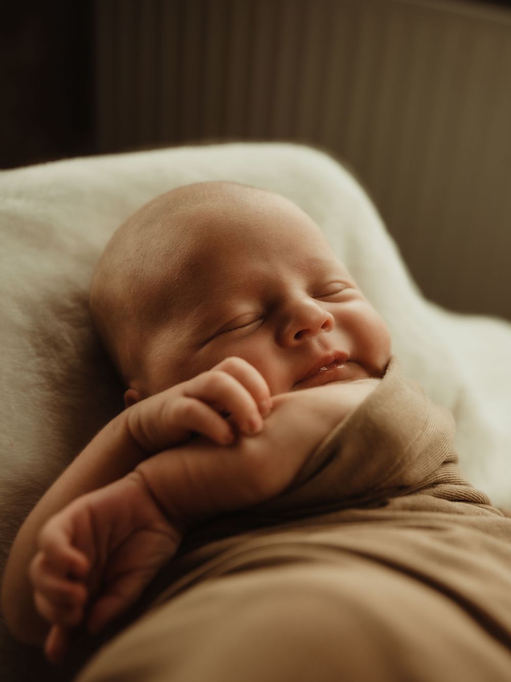 Newborn baby smile closeup