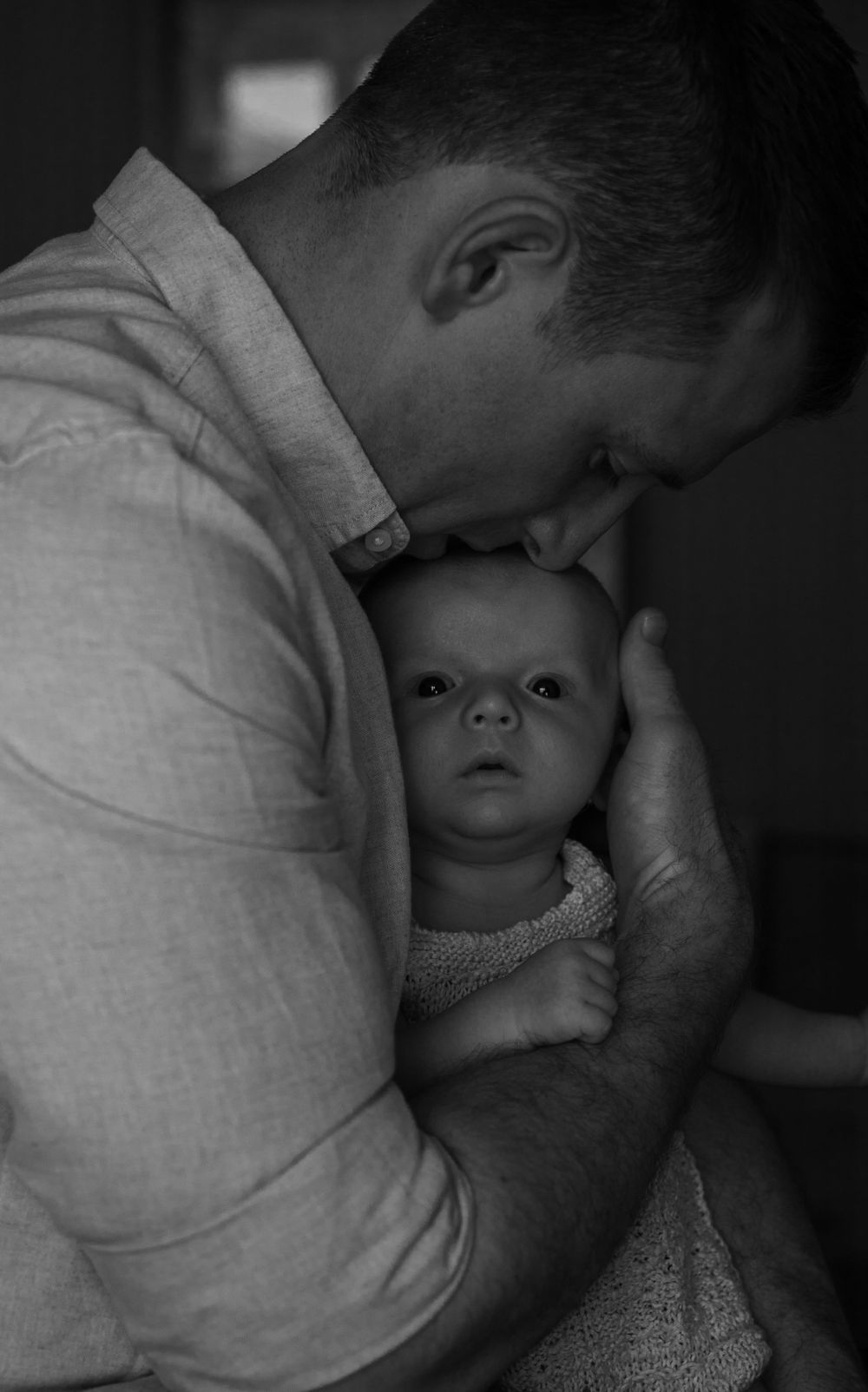 Newborn baby father kiss