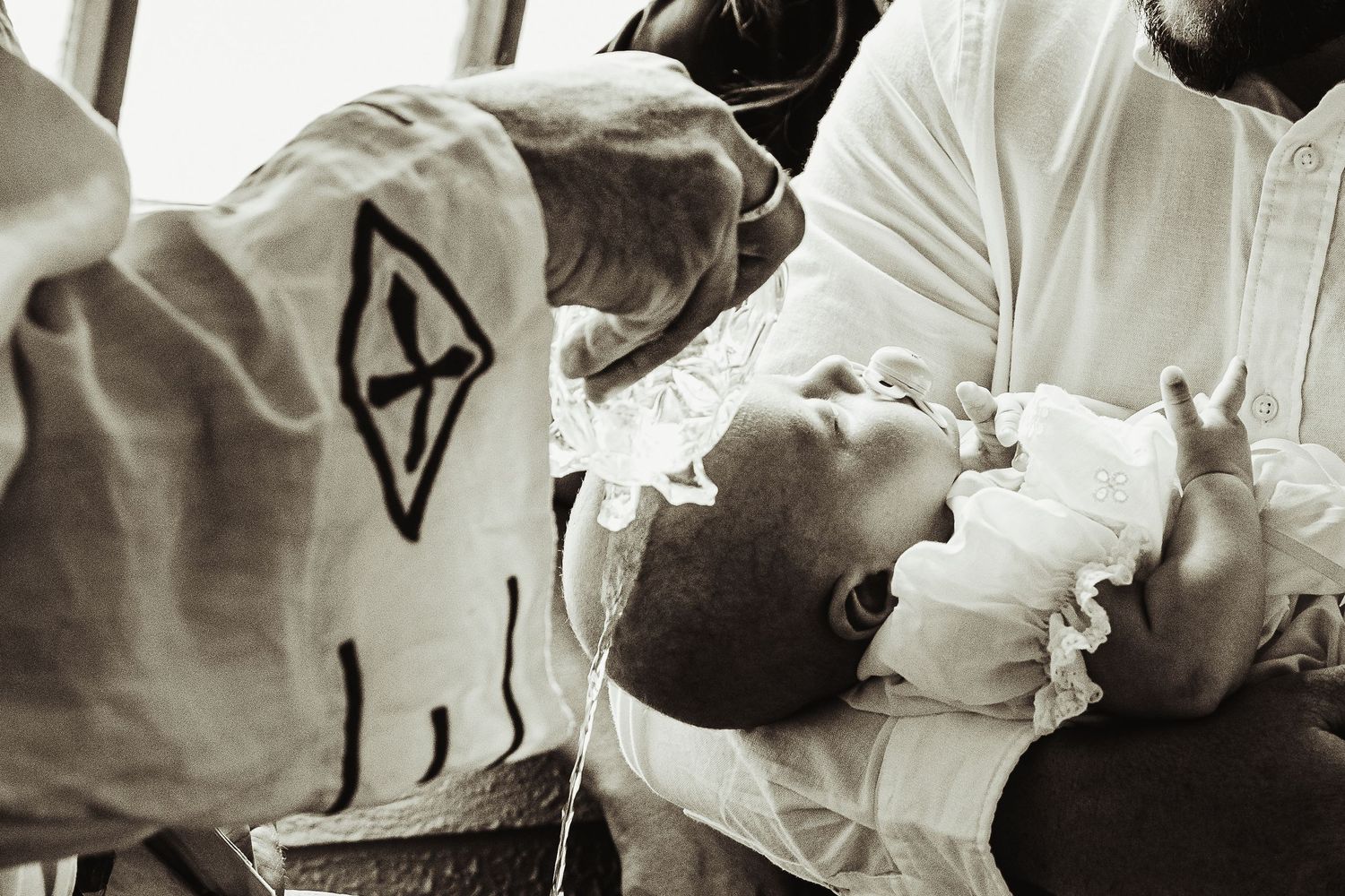 Baby boy getting baptised