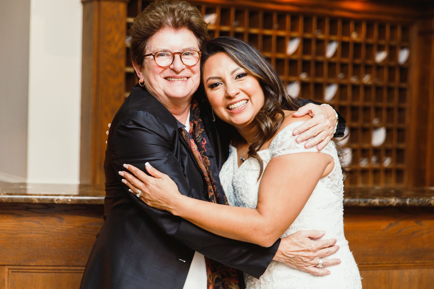 Warm emotional wedding day moments captured in a series of candid embraces.